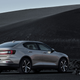 A photo of the rear quarter on a beige Polestar 2 EV.
